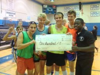 Dane Lemmon, Troy McLaughlin, Jeff Henkel, and Ryan Montgomery ("That Team") pose with Mayokun Ojo and their prize after winning the Fall Olympics.