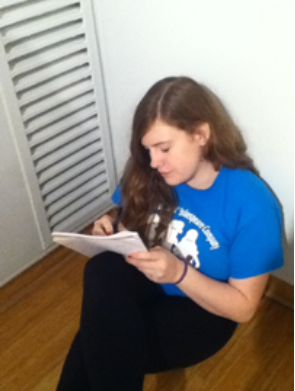 Sophomore Kate Cognard-Black writes a poem at the poetry workshop.