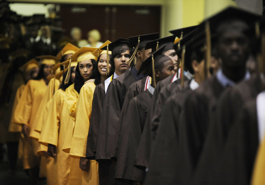 (photo by noah scialom) B582154531Z.1 dow},  Students lined up to find their seats at Ft. Meade High School's graduation on Monday, June 11th.