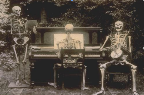 Three skeletons at the piano