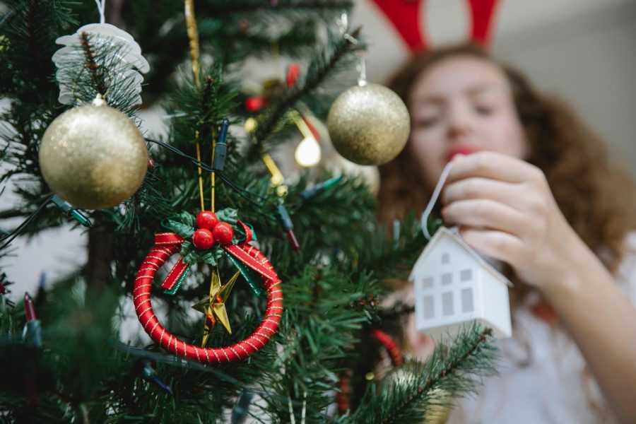 Girl decorating her tree.