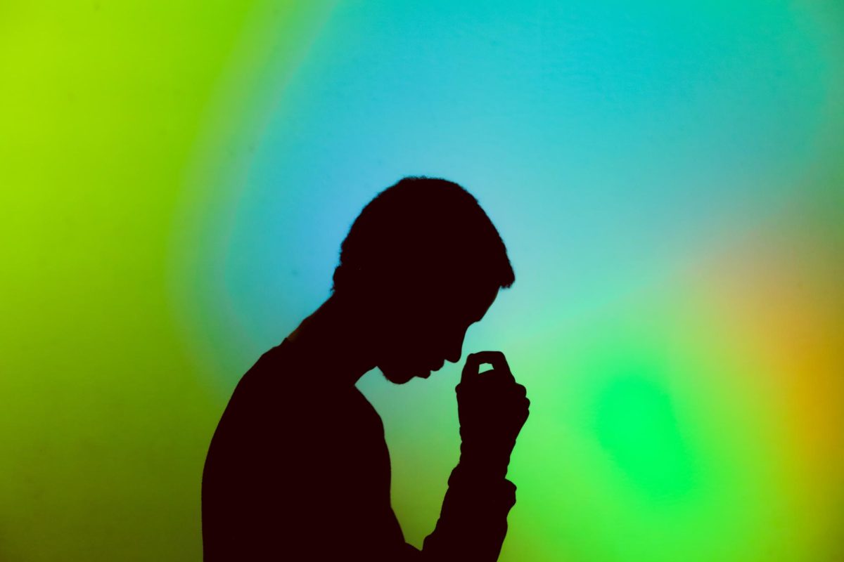 Silhouette of Stressed Man // Image by Gift Habeshaw via Unplash.