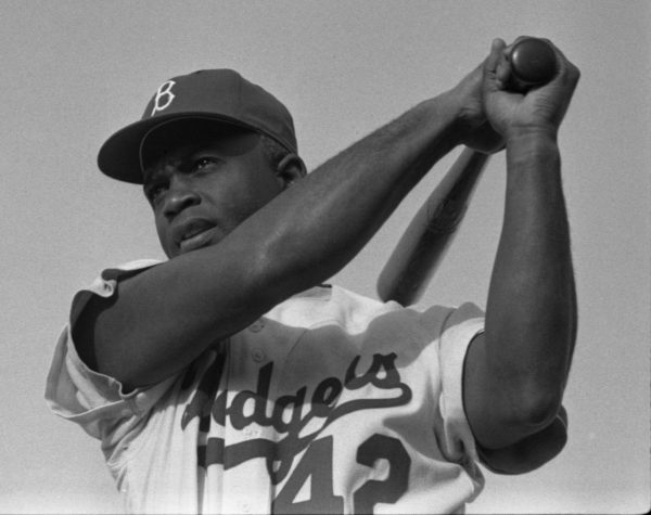 Image of Jackie Robison swinging a baseball bat. // Image via pxhere.com 