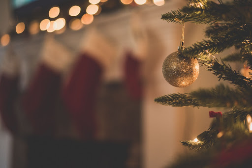 Image of Ornaments hanging from a Christmas tree. Image from Chad Madden via Unsplash.